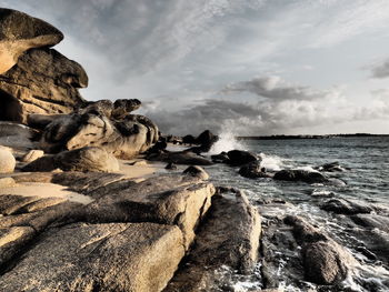 Scenic view of sea against cloudy sky