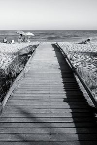 Pier over sea against sky