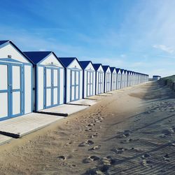 Beach huts against sky