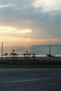 Scenic view of beach against sky during sunset