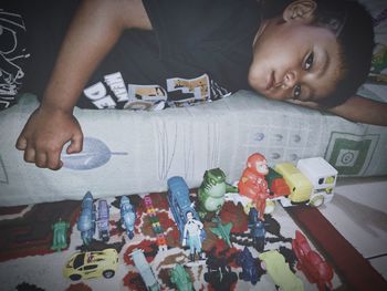 Portrait of boy playing with toy