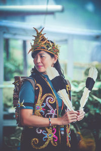 Portrait of smiling young woman wearing traditional clothing