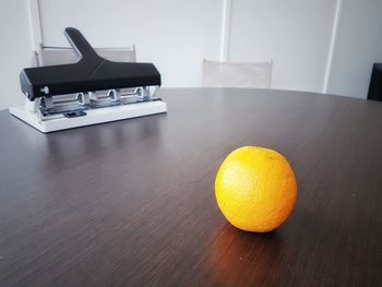 Close-up of orange on table at home