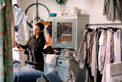 Female customer shopping at fashion store