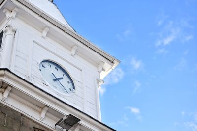 Low angle view of clock tower against sky