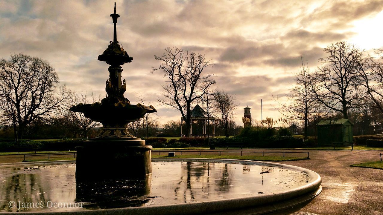 WATER FOUNTAIN IN PARK AGAINST SKY