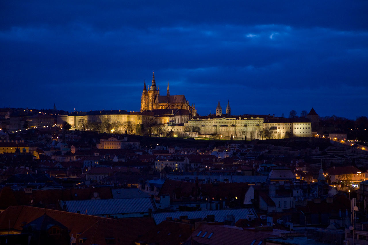 VIEW OF ILLUMINATED CITY AT DUSK