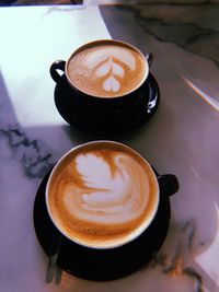 High angle view of cappuccino on table