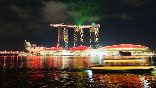 Illuminated ferris wheel at night