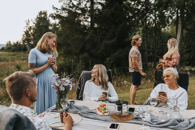 Friends talking in garden