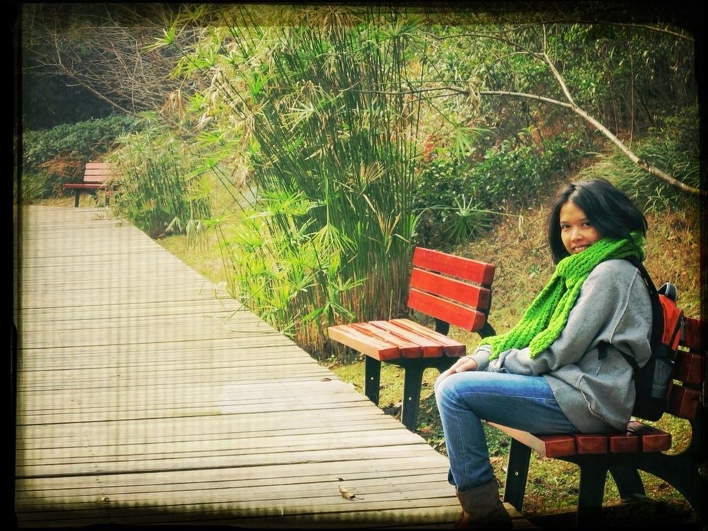 lifestyles, leisure activity, grass, men, tree, sitting, bench, green color, full length, auto post production filter, casual clothing, transfer print, field, childhood, growth, relaxation, day, person