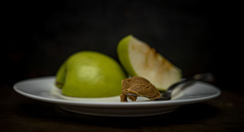 Close-up of fruits in plate on table