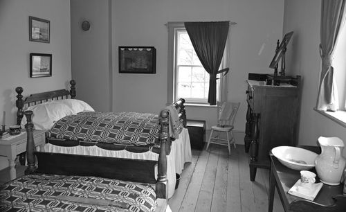 Empty chairs and tables in room