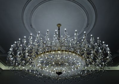 Low angle view of illuminated chandelier