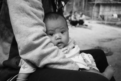 Portrait of mother and baby outdoors