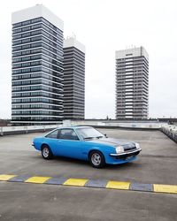 Car in city against sky