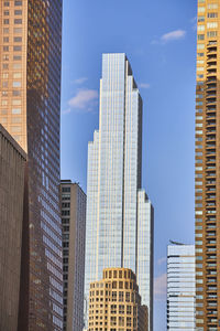 Low angle view of skyscrapers against sky