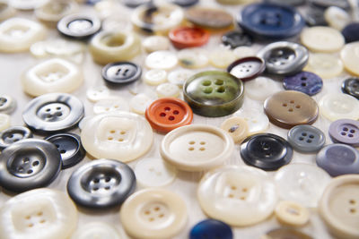 High angle view of various buttons on table