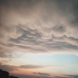 Low angle view of dramatic sky during sunset