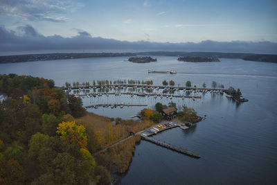 Scenic view of lake by trees against sky during autumn