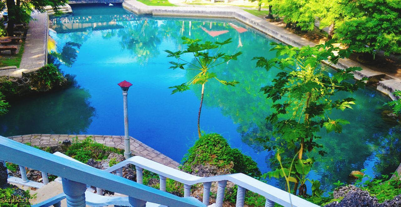 HIGH ANGLE VIEW OF SWIMMING POOL IN PARK