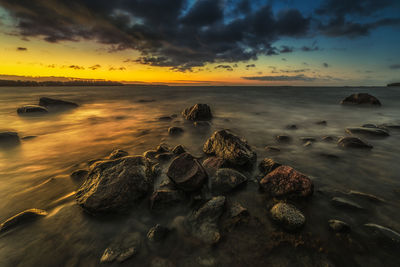 Scenic view of sea against sky during sunset