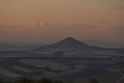 Scenic view of mountains against sky during sunset