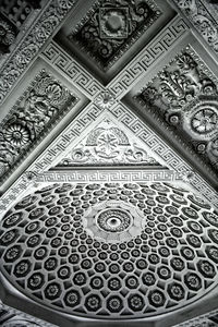 Low angle view of carvings on ceiling