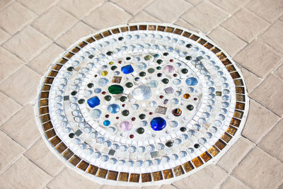 High angle view of gemstones attached on floor