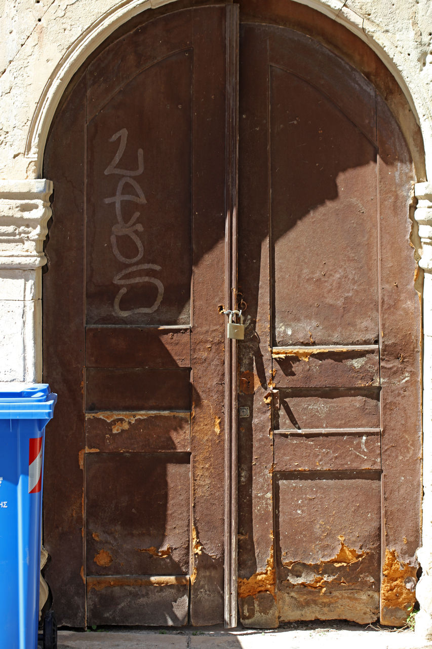 door, entrance, architecture, building exterior, built structure, closed, no people, day, iron, building, arch, outdoors, doorway, protection, old, security, wood