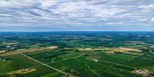 A view of the countryside of wisconsin during the summer with country roads and farms