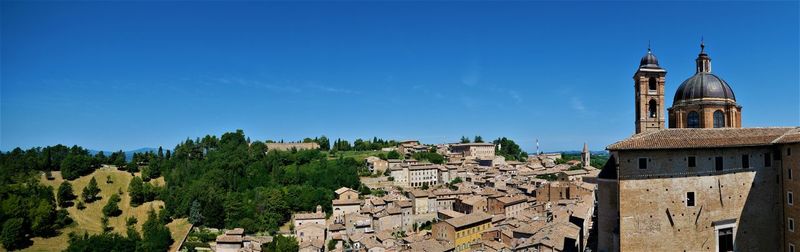 Panoramic view of old building against clear blue sky