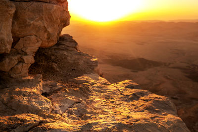 Rock formations in desert during sunset