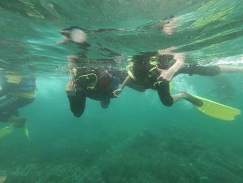 People swimming in sea