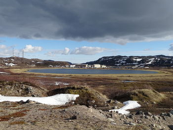 Scenic view of landscape against sky during winter