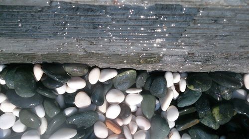 Close-up of pebbles in water