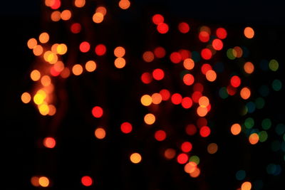 Defocused image of illuminated lights at night