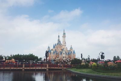 Shanghai disneyland against cloudy sky