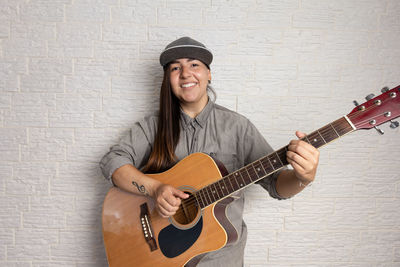 Portrait of man playing guitar