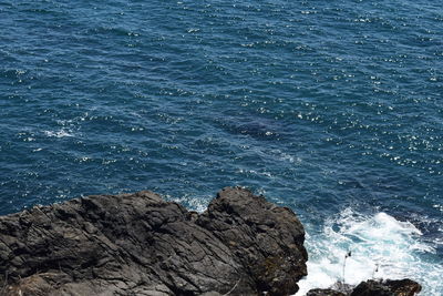 High angle view of rock formation in sea