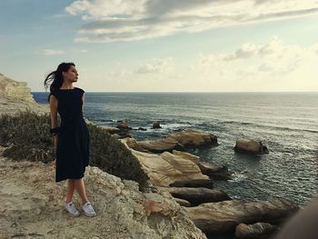 Young woman looking at sea