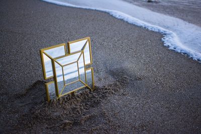 High angle view of mirror on beach