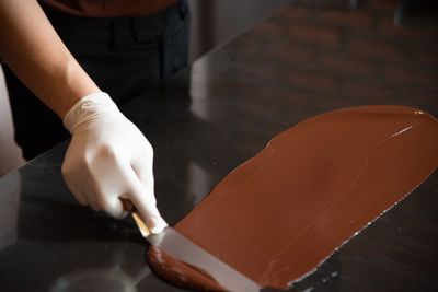 Midsection of person preparing food