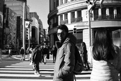 People crossing road in city