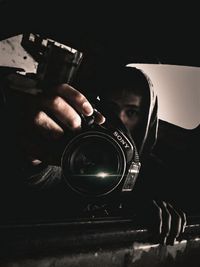 Close-up portrait of man photographing
