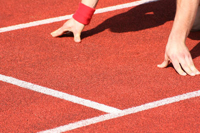 Cropped image of person at track field
