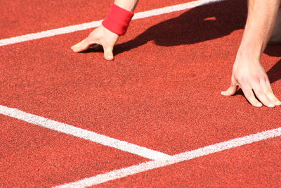 Low section of person standing on tiled floor