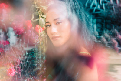 Portrait of beautiful young woman looking away