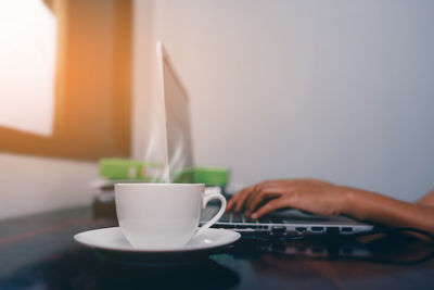 Close-up of coffee cup on table