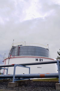 Low angle view of text on ship against sky